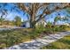 House exterior showcasing garage and mature landscaping at 3651 Country Place Blvd, Sarasota, FL 34233