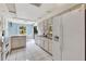 Galley kitchen with white cabinets and tile flooring at 3651 Country Place Blvd, Sarasota, FL 34233