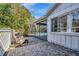 Charming brick patio with seating area overlooking the pool at 3651 Country Place Blvd, Sarasota, FL 34233