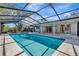 Relaxing pool area with a screened enclosure at 3651 Country Place Blvd, Sarasota, FL 34233