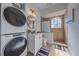 Convenient laundry room with stackable washer and dryer at 366 S Creek Ct, Osprey, FL 34229