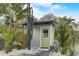 Enjoy this light green shed in the middle of a tropical oasis at 3822 75Th E Ter, Sarasota, FL 34243