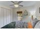 Bright bedroom with a comfy bed, white shutters, and a window overlooking the backyard at 3822 75Th E Ter, Sarasota, FL 34243