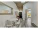 Small dining area with white table and chairs near the entryway at 3822 75Th E Ter, Sarasota, FL 34243