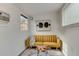 Bright living room with mustard sofa, wood coffee table, and abstract art at 3822 75Th E Ter, Sarasota, FL 34243