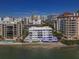 Aerial view of condo building on waterfront at 400 Golden Gate Pt # 11, Sarasota, FL 34236