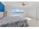 Main bedroom with water view and blue accent wall at 400 Golden Gate Pt # 11, Sarasota, FL 34236