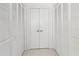 White louvered doors covering multiple closets at 400 Golden Gate Pt # 11, Sarasota, FL 34236