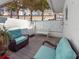 Private patio with seating and outdoor shower at 400 Golden Gate Pt # 11, Sarasota, FL 34236