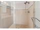 Walk in shower with glass enclosure and pebble floor at 400 Golden Gate Pt # 11, Sarasota, FL 34236