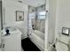 Clean bathroom with a bathtub, shower, and white cabinets at 4029 9Th S Ave, St Petersburg, FL 33711