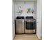 Bright laundry room features a washer, dryer, and shelving at 4029 9Th S Ave, St Petersburg, FL 33711