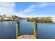 Scenic view of the canal with lush greenery and other homes at 4110 Commodore Blvd, Cortez, FL 34215