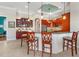 Island kitchen with granite countertops and custom cabinetry at 4110 Commodore Blvd, Cortez, FL 34215