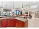 Kitchen island with granite countertop and breakfast bar at 4110 Commodore Blvd, Cortez, FL 34215