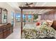 Main bedroom with a canopy bed and water views at 4110 Commodore Blvd, Cortez, FL 34215
