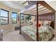 Main bedroom with a canopy bed and water views at 4110 Commodore Blvd, Cortez, FL 34215