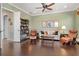 Sitting room with comfortable seating and hardwood floors at 4110 Commodore Blvd, Cortez, FL 34215
