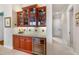 Wet bar with granite countertop and wine cooler at 4110 Commodore Blvd, Cortez, FL 34215