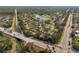 Aerial view of community with a canal and road at 4351 Trails Dr # 4-2, Sarasota, FL 34232