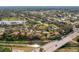 Aerial view of community near a bridge and water at 4351 Trails Dr # 4-2, Sarasota, FL 34232