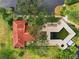 Aerial view of home, pool, and surrounding landscape at 4351 Trails Dr # 4-2, Sarasota, FL 34232