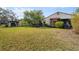 Large backyard featuring a grassy area and a deck at 4351 Trails Dr # 4-2, Sarasota, FL 34232