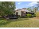 Home exterior showcasing a deck and lush landscaping at 4351 Trails Dr # 4-2, Sarasota, FL 34232