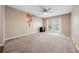 Spacious bedroom with ceiling fan and doors to balcony at 4351 Trails Dr # 4-2, Sarasota, FL 34232