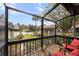 Screened porch with wooden deck and view of community at 4351 Trails Dr # 4-2, Sarasota, FL 34232