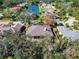 Aerial view of house and neighborhood, showcasing location and landscaping at 4679 Country Manor Dr, Sarasota, FL 34233