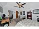 Cozy bedroom with a desk setup and ample closet space at 4679 Country Manor Dr, Sarasota, FL 34233