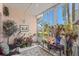 Bright sunroom featuring large windows and various plants at 4705 Sand Trap Street E Cir # 106, Bradenton, FL 34203