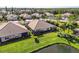 Aerial view of homes and pond at 4891 Maymont Park Cir, Bradenton, FL 34203