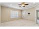 Bright bedroom with ceiling fan, window with shutters, and neutral decor at 4891 Maymont Park Cir, Bradenton, FL 34203