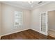 Spacious bedroom with hardwood floors, plantation shutters, and French doors at 4891 Maymont Park Cir, Bradenton, FL 34203