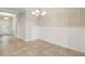 Dining area with tile flooring, neutral walls, and wainscoting at 4891 Maymont Park Cir, Bradenton, FL 34203