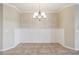 Bright dining room with elegant chandelier and decorative wall paneling at 4891 Maymont Park Cir, Bradenton, FL 34203