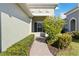 Brick walkway to the front entrance with well-maintained landscaping at 4891 Maymont Park Cir, Bradenton, FL 34203