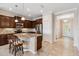 Kitchen features granite countertops, stainless steel appliances, and an island at 4891 Maymont Park Cir, Bradenton, FL 34203