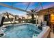 Hot tub on patio with sunset view and lake view at 5061 Seagrass Dr, Venice, FL 34293