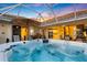 Relax in this luxurious hot tub, complete with a covered patio and views of the surrounding landscape at 5061 Seagrass Dr, Venice, FL 34293