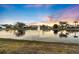 Enjoy serene lake views with a lovely fountain and stunning sunset colors at 5061 Seagrass Dr, Venice, FL 34293