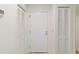 Interior entryway with white doors and built-in storage at 5269 Myrtle Wood Rd # 35, Sarasota, FL 34235