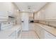 Kitchen boasts white cabinets, ample counter space, and modern appliances at 5269 Myrtle Wood Rd # 35, Sarasota, FL 34235