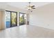 Living room with tile floors, sliding doors, and ceiling fan at 5269 Myrtle Wood Rd # 35, Sarasota, FL 34235