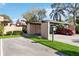 Carport with a red car parked and green space at 5269 Myrtle Wood Rd # 35, Sarasota, FL 34235