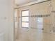 Walk-in shower with grab bars and tiled walls at 5269 Myrtle Wood Rd # 35, Sarasota, FL 34235