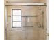 Walk-in shower with tiled walls and glass enclosure at 5269 Myrtle Wood Rd # 35, Sarasota, FL 34235