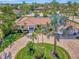 Luxury home with circular driveway, lush landscaping at 531 N Spoonbill Dr, Sarasota, FL 34236